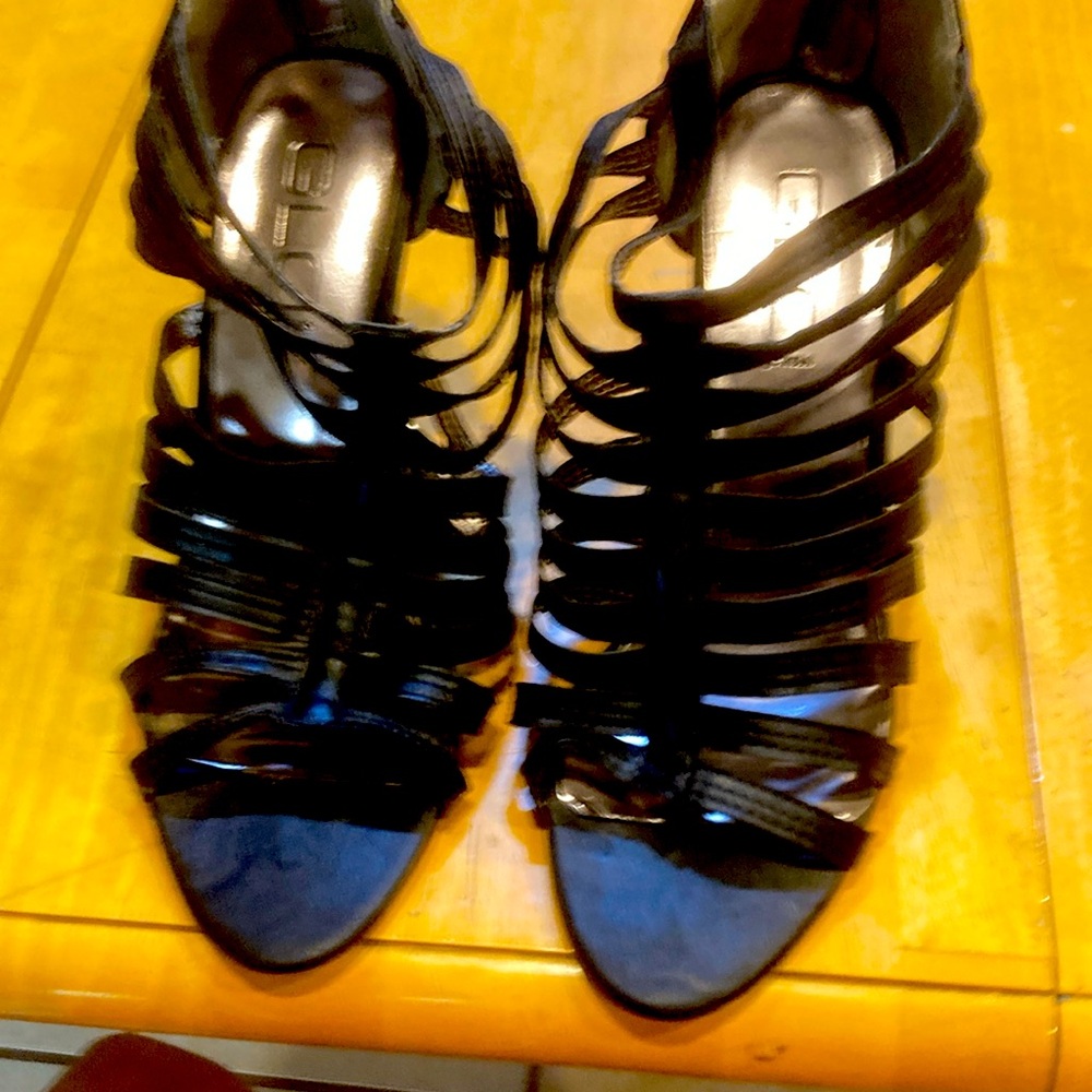 Women’s black shoes. Black with straps and zippers in back. Size 8 W